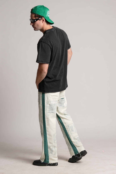 DISTRESSED PATCHWORK GREEN FLARED VALKYRE JEANS